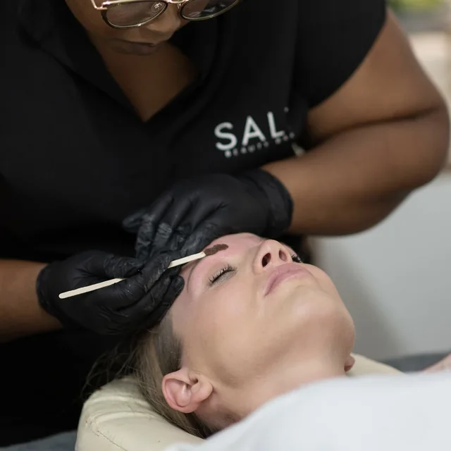 Brow tint being applied by a SALT therapist