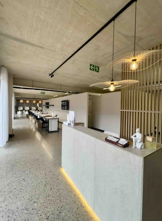 Inside SALT Beauty Bar: a warm, light-filled reception with natural wood and neutral finishes